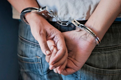 criminal in handcuffs